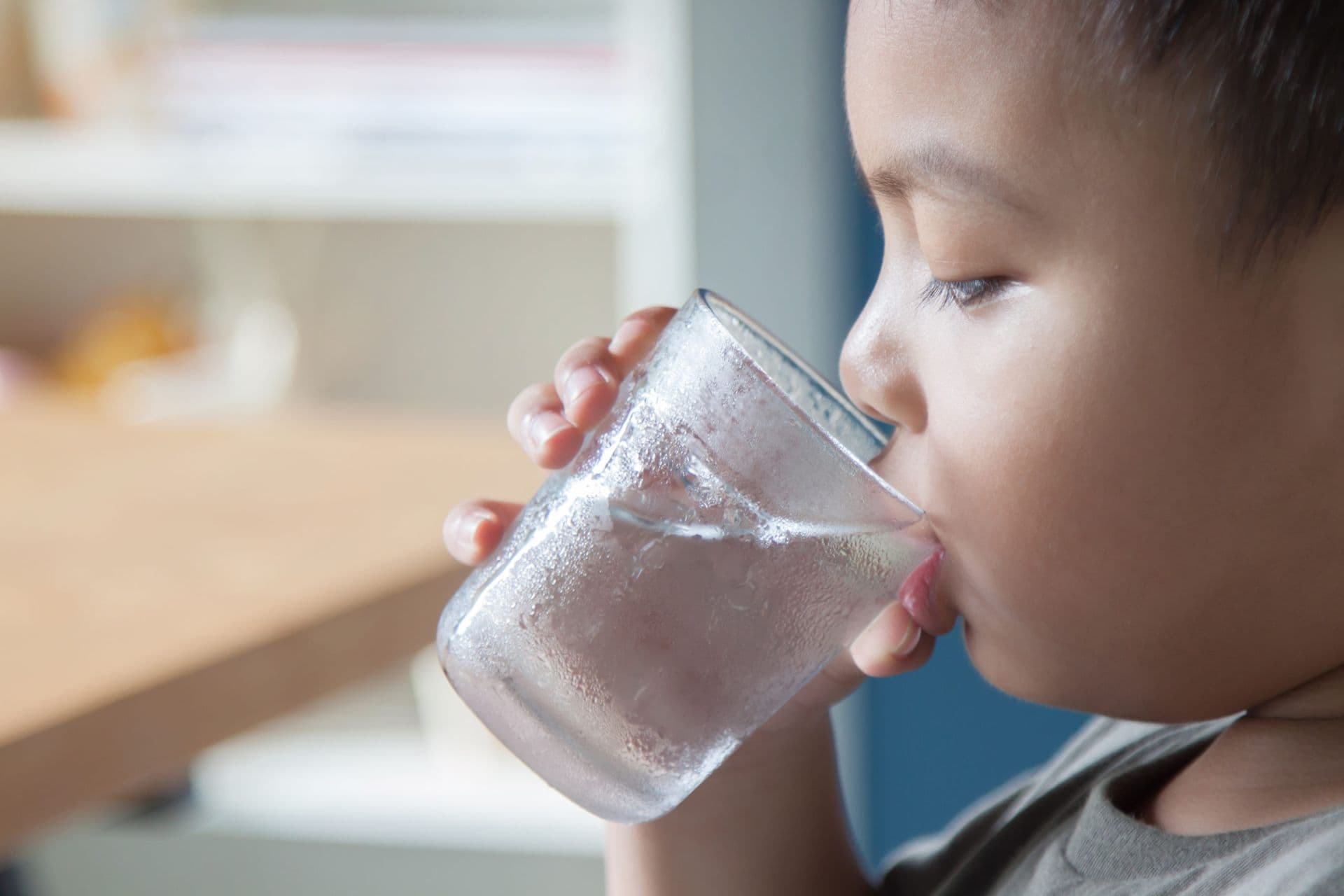 Child Drinking Glass of Water