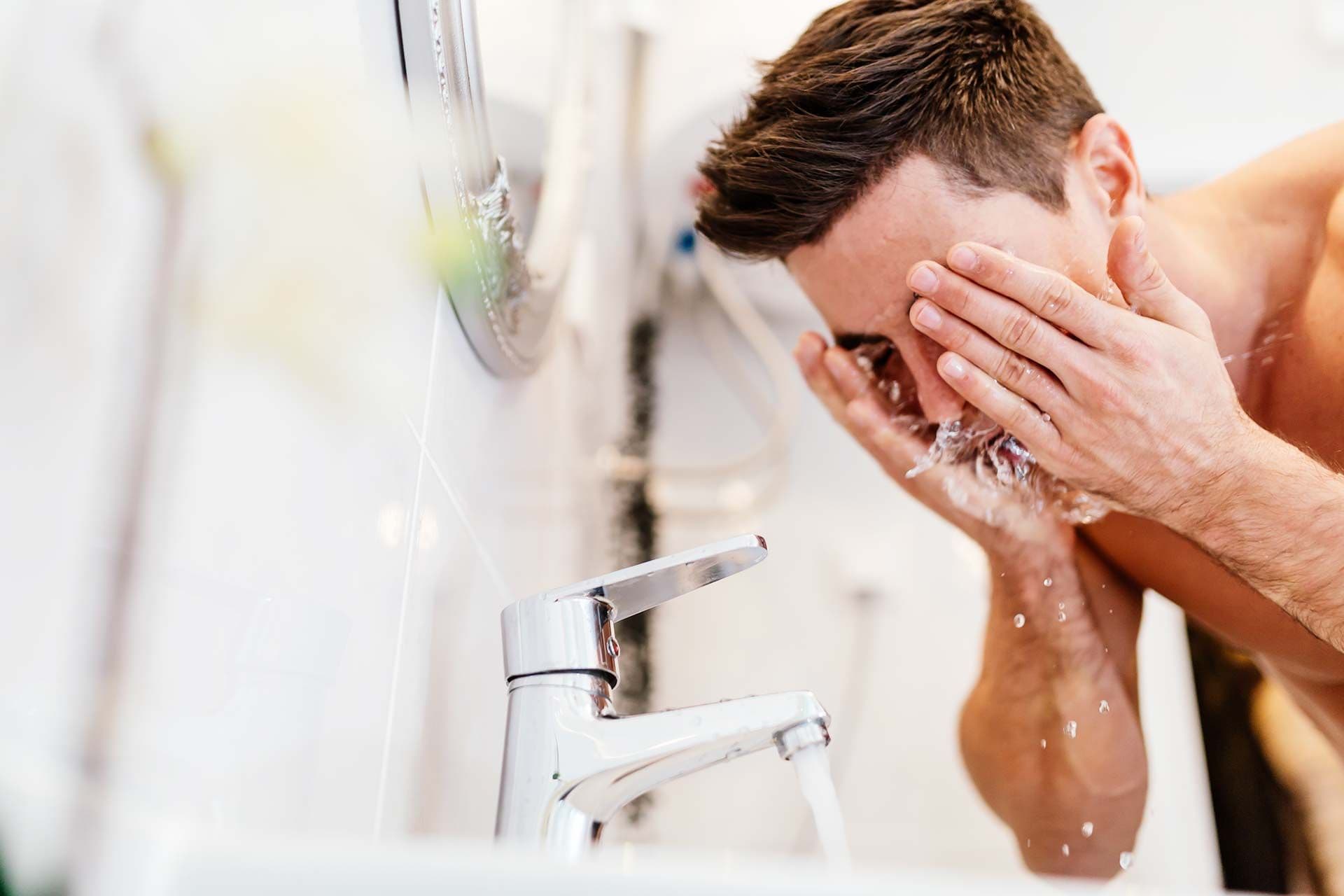 person washing face